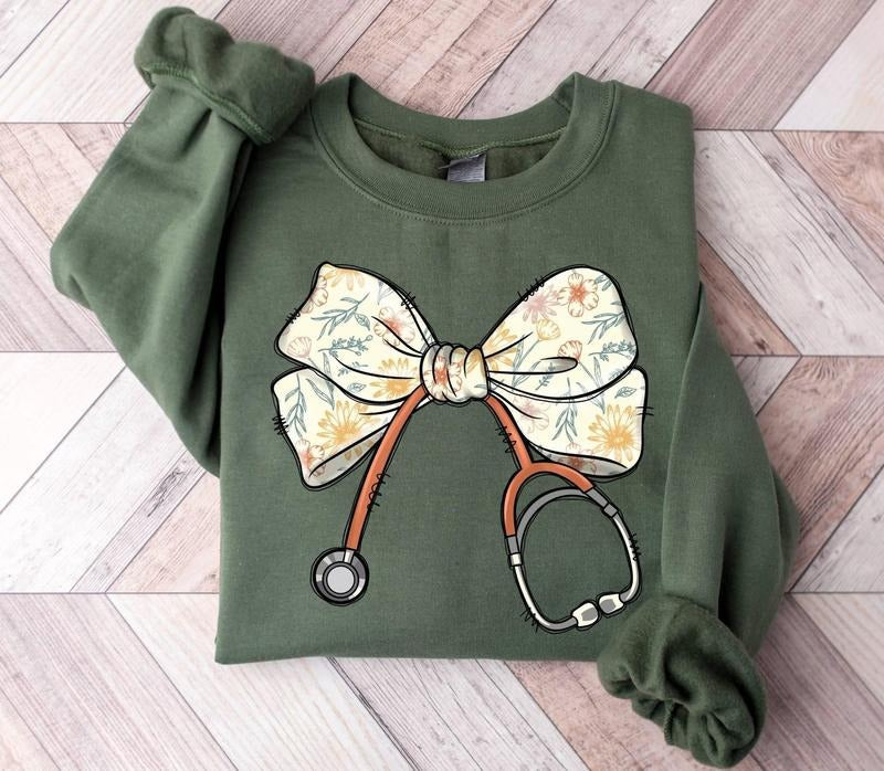 Nurse Coquette Bow Sweatshirt, Stethoscope Bow Sweatshirt, Nurse Ribbon Sweatshirt, Healthcare Professionals Shirt, Gift For RN ER Sweater, Nurse Appreciation Gift