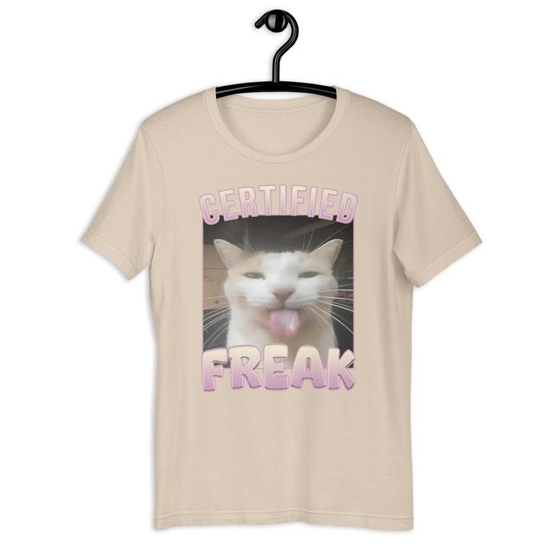Certified Freak Funny Cat Meme T-Shirt, Ironic Unisex Graphic Apparel, Playful Clothing Gift for Meme Lovers and Quirky Trendsetters