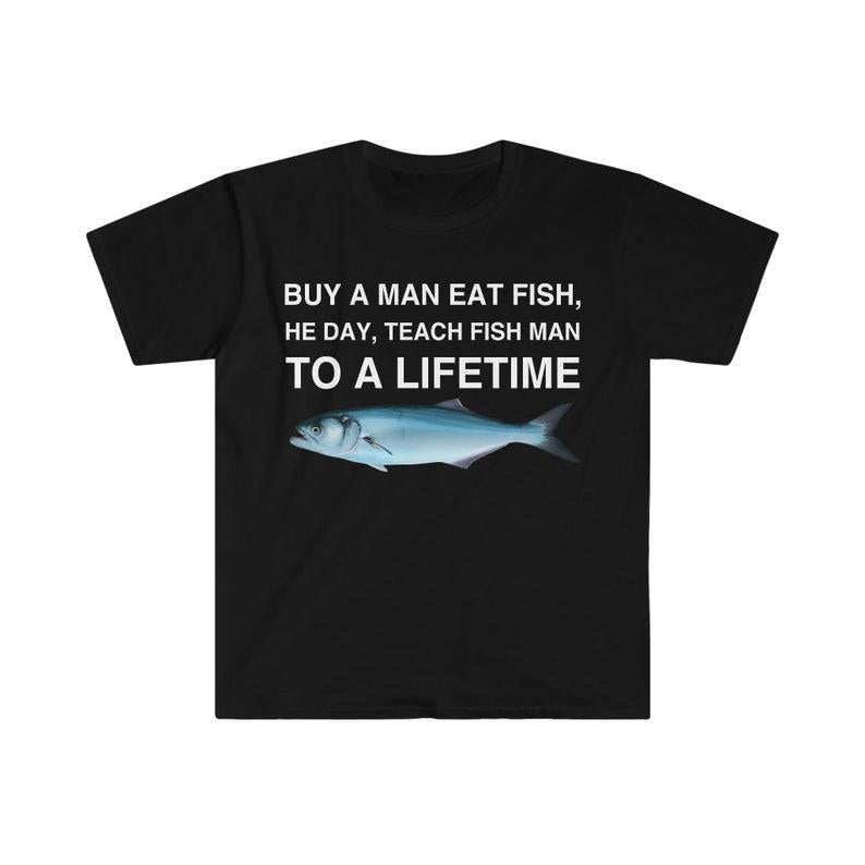 Buy a Man Eat Fish T-Shirt, He Day Teach Fish Man, Lively Meme T-Shirt for Humor Lovers, Unisex Casual Wardrobe Statement Piece