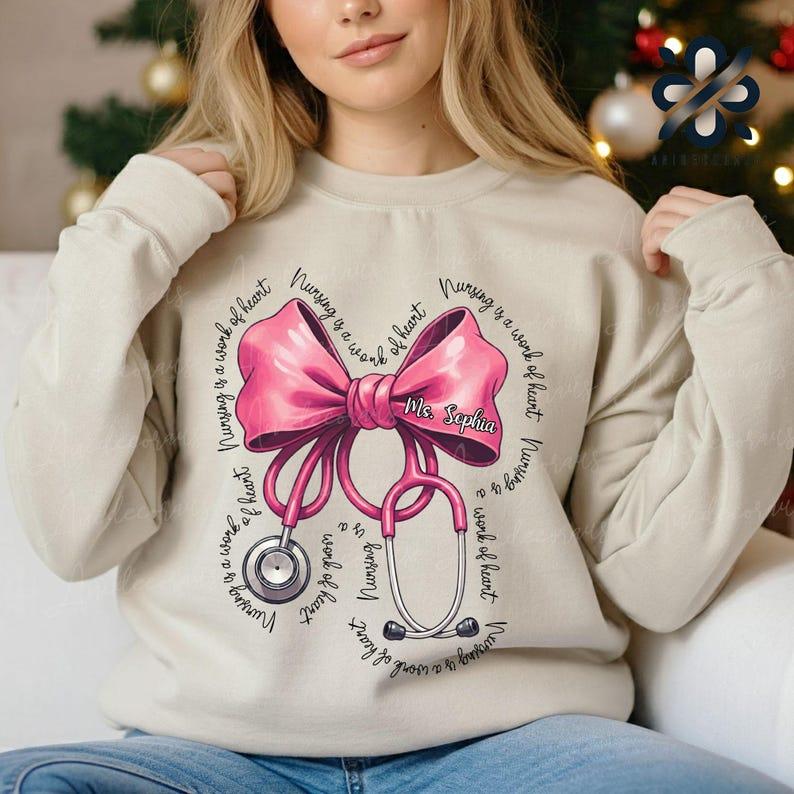 Personalized Coquette Nurse Stethoscope Bow Sweatshirt, Nurse Appreciation, Christmas Gift for Nurse, Nursing Pink Bow Shirt, Christmas Shirt