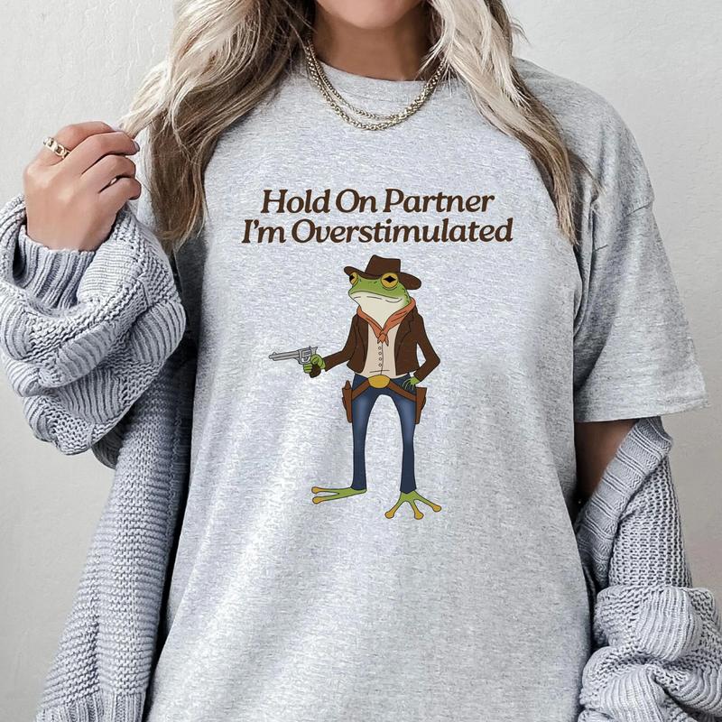 Hold On Partner, I'm Overstimulated Shirt - Quirky Cowboy Frog Tee, Unhinged Vibes, Gen Z Humor, Perfect for Meme Lovers