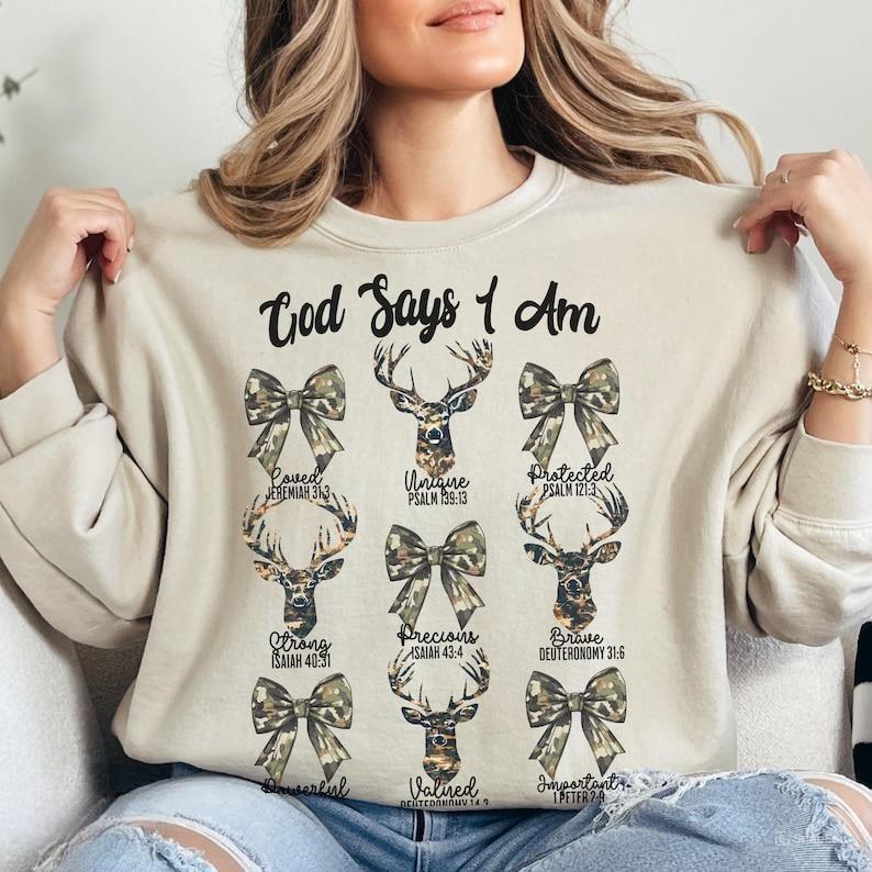 Christian God Say I Am Camo Dear Hunting Crewneck Sweatshirt, Hunting Season, Bible Verse, Camo Coquette Bow Hunting Shirt