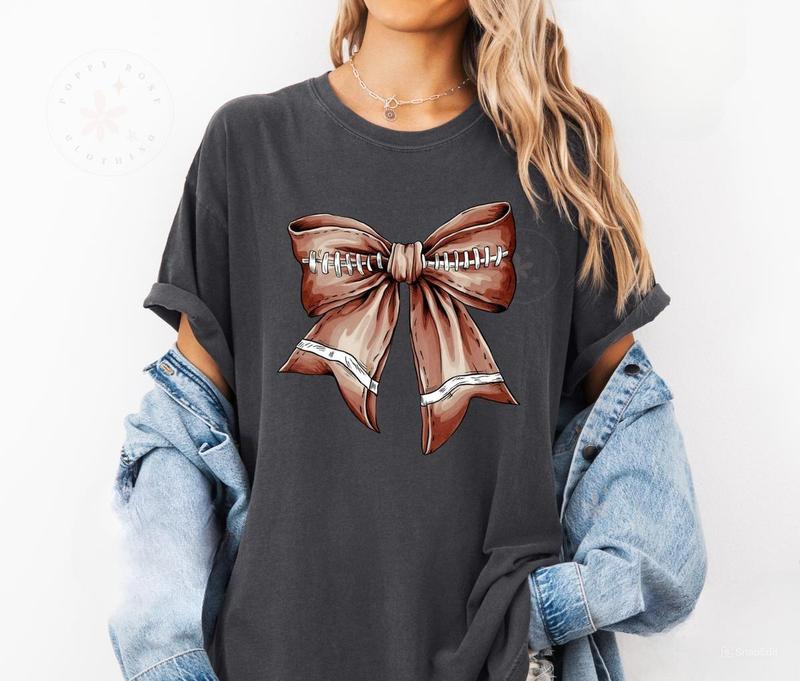 Football Bow Shirt, Womens Football Tee, Womenswear Oversized Crewneck, Coquette Pink Bow Tee, Graphic Printed Unisex Classic Comfort Cotton T-Shirt i
